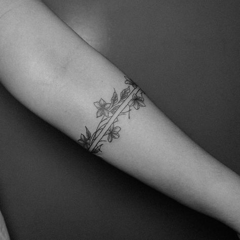 An armband tattoo featuring sampaguita flowers often carries cultural and personal significance. The sampaguita, also known as the Philippine jasmine, is the national flower of the Philippines. It symbolizes purity, simplicity, humility, and strength. In the context of an armband tattoo, it may represent pride in Filipino heritage, a connection to one’s roots, or the embodiment of the qualities that the flower symbolizes. Additionally, armband tattoos can signify continuity, protection, and l... Filipino Arm Band Tattoo, Filipino Tattoos Women, Philippine Tattoo Design, Filipino Tribe Tattoo Women, Philippine Symbols, Sampaguita Flower Tattoo Philippines, Filipino Sun Tattoo Women, Filipino Tattoos Women Traditional, Filipino Star Tattoo