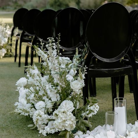 As a wedding planner, I’m always thrilled to see classic combinations that never go out of style. One of my favorites? The stunning contrast of black chairs paired with pristine white flowers. 🤍✨ ✨ Why It Works: Sophisticated Contrast: The sleek black chairs provide a chic, modern touch that beautifully contrasts with the purity of white blooms. Elegant Simplicity: This color palette exudes timeless elegance, making it perfect for a ceremony that’s both refined and understated. Versatil... Wedding Ceremony Chairs, Louis Chairs, Black Chairs, Ceremony Chairs, Black Chair, Black Flowers, Black Wedding, Wedding Theme, My Favorites