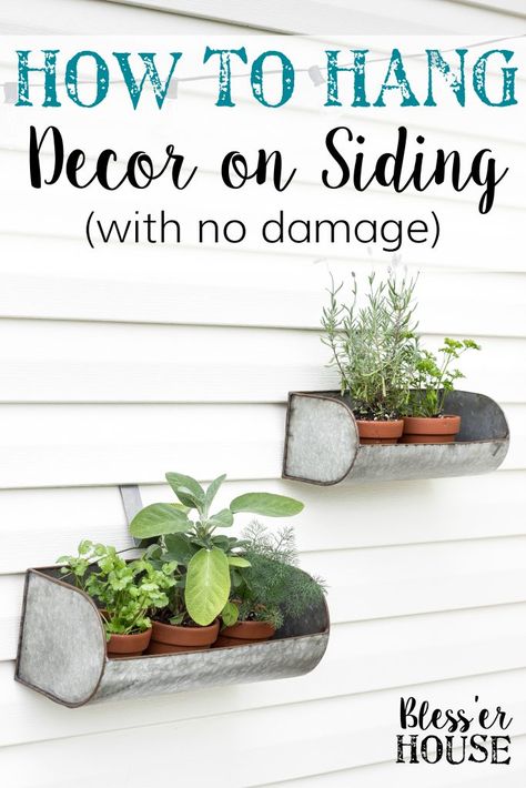 How to Hang Decor on Siding With No Damage | blesserhouse.com - Good tip for making outdoor siding look not so naked! Outdoor Siding, Hanging Patio Lights, Small Patio Spaces, Hang Decor, Patio String Lights, Patio Wall, How To Hang, Decks Backyard, Garden Decorations