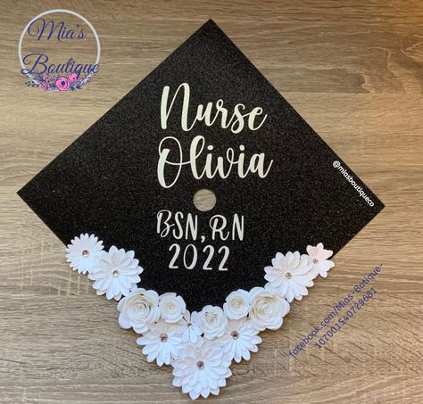 Floral Nursing Graduation Cap Graduation soon? What better way to celebrate your special day with a decorated cap topper. * Size: 9.5 by 9.5 inches with a precut tassel hole in the center (This is the standard size for graduation caps but if your cap is a different size pls message me so I can make the change) * Flowers are handmade and are not sold individually other and colors are available * Caps Toppers are handmade and are not a sticker/print * Graduation cap & glue are not included this is Glitter Grad Cap, Bsn Graduation Cap, Nurse Graduation Cap Designs, Nursing Graduation Cap, Nurse Graduation Cap, Nursing Graduation Pictures, Custom Graduation Caps, College Graduation Cap Decoration, Nursing School Graduation