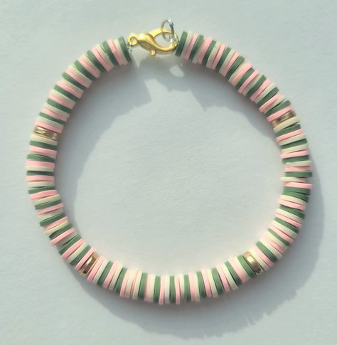 Army Green, Peach, and White Heishi Bead Bracelet. Cottage Core Clay Bead Bracelet, Clay Beads Green Ideas, Pink And Green Clay Bead Bracelet, Clay Heishi Bead Bracelets, Clay Bead Bracelet Ideas Aesthetic Green, White Clay Bead Bracelet Ideas, Clay Bead Bracelet Ideas Spring, Winter Clay Bead Bracelet Ideas, Green Clay Bead Bracelet Ideas