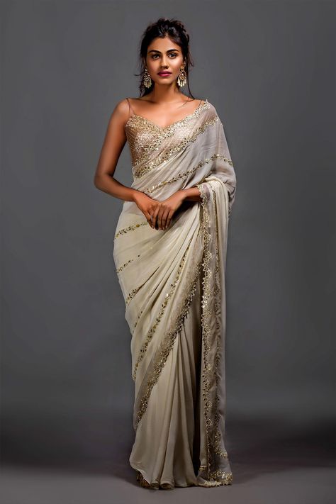 Shop for Izzumi Mehta White Brocade Zardozi Embroidered Saree And Blouse for Women Online at Aza Fashions Luxury Saree With Padded Blouse For Reception, Luxury Evening Saree With Padded Blouse, Luxury Lace Saree With Zari Work, Luxury Georgette Saree With Dabka, Luxury Bollywood Saree With Pallu, Luxury Semi-stitched Saree With Dabka Details, Luxury Lace Work Saree, Luxury Bollywood Embroidered Saree Dress, Luxury Semi-stitched Saree With Dabka