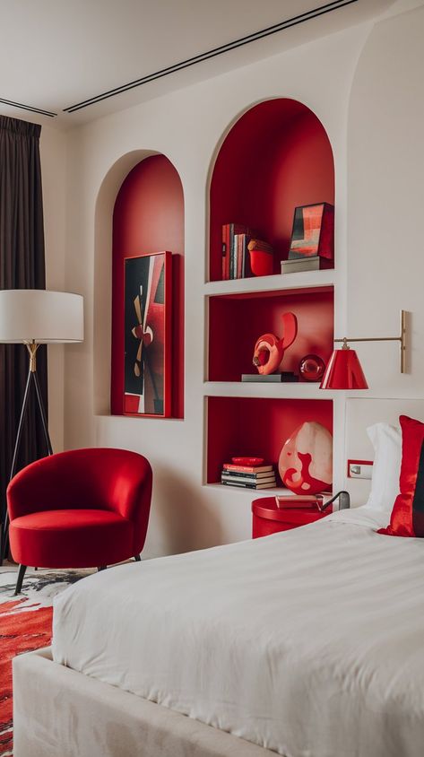 Discover the perfect blend of modern luxury and coziness in this stunning bedroom! The crisp white bed and walls create a peaceful environment, while rich red accents—a stylish chair, elegant lamp, and tasteful decorative items—inject warmth and personality. Soft, inviting lighting enhances the ambiance, making this space feel like a high-end retreat. #homedecor #homedesign #bedroomredo #bedroomdecor #bedroomdecorinspo Red Bedroom Ideas For Women, White And Red Bedroom, Red Accent Bedroom, Red And White Bedroom, Red Bedroom Walls, Red Interior Design, Red Bedroom Decor, Ny Apartment, Silver Aesthetic