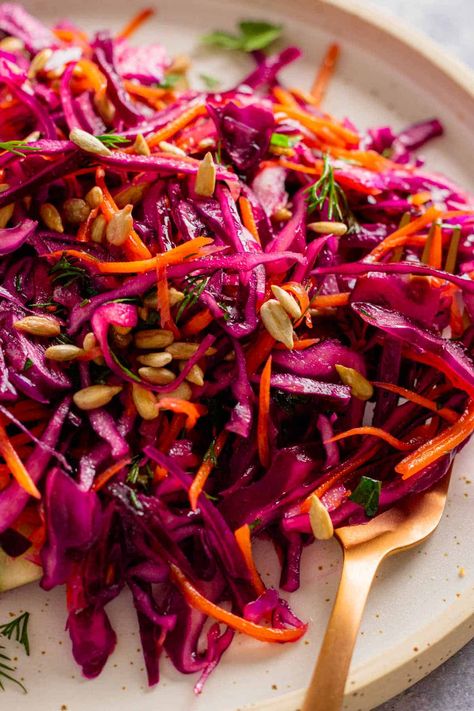 Looking for a crunchy salad with a light, tangy dressing? Try this red cabbage salad - it's perfect for any occasion, from weeknight dinners to potlucks. Top it up with some fried chicken or roasted salmon. Red Cabbage And Beet Salad, Salad Red Cabbage, Red Cabbage Salad Recipes, Red Pepper Salad, Roasted Red Cabbage, Red Cabbage Recipes, Red Cabbage Salad, Healthy Snack Bars, Cabbage Salad Recipes