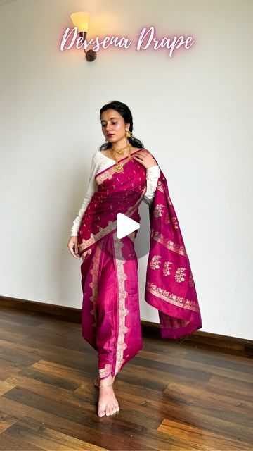 𝐀𝐫𝐜𝐡𝐞𝐞 | Saree Drapes on Instagram: "Devsena Saree Look from Bahubali | Save and send this easy saree tutorial to a saree lover 🌸

Pure silk saree of the day- is a katan banarasi in dual tone of plum and pink. I believe it is the saree that actually enhanced the look of the drape.

How to wear saree in Devsena Style-
🌸 Choose weightless and easy drape pure silk saree fabrics like katan silk, mulberry silk, mysore silk.
🌸 Pick Kanjivaram, Kanchipuram, satin silk and tussar silk if they’re longer than 5.5m.
🌸 Pick a contrasting blouse design so your saree highlights well. Refer to pinterest for blouse design ideas.
🌸 Follow the above tutorial, keep pinning every time you pleat the saree to easily undo it whenever required.
🌸 Accessories with temple jewellery, go for chain jhumki, Devsena Saree Draping Tutorial, Styling Banarasi Saree, Pink Silk Saree Look, Tussar Silk Saree Blouses, Pink Dress Jewelry Ideas, Devsena Look, Stylish Saree Draping Style, Wedding Looks Indian Sister, Satin Saree Look