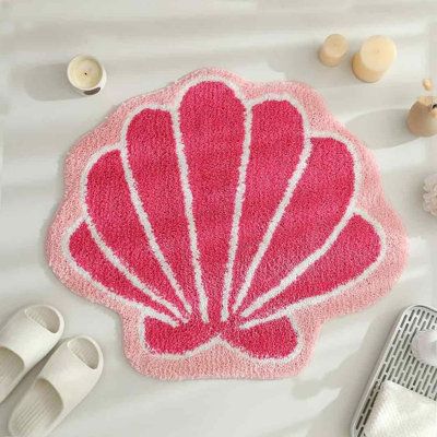 Beachcrest Home™ Bretz Bath Rug Polyester in Pink | 22" W X 26" L | Wayfair Bathroom Decor Preppy, Cute Bathroom Rugs, Coastal Cowgirl Bathroom, Preppy Rugs, Seashell Rug, Tufted Rug Ideas, Preppy Bathroom Decor, Rug Tufting Ideas, Beachy Bathrooms