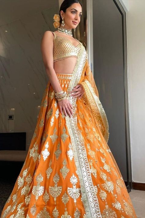 Kiara Advani In An Orange Lehenga Kiara Advani Lehenga, Orange Colour Dress, Bridesmaid Looks, Lehenga Hairstyles, Falguni Shane Peacock, Orange Lehenga, Indian Bridesmaid Dresses, Simple Lehenga, Indian Outfits Lehenga