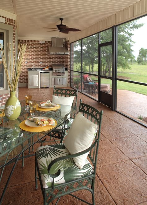 The screened in porch and the outdoor kitchen make this the perfect place to enjoy the outdoors! Screen Porch Outdoor Kitchen, Screened In Grilling Porch, Screen Porch Off Kitchen, Enclosed Patio Kitchen, Screened In Patio With Grill Area, Partial Enclosed Patio Ideas, Screened In Porch Florida, Outdoor Kitchen Sunroom, Outdoor Kitchen In Screened Porch