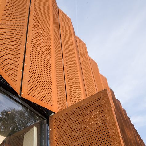 Årstiderne Arkitekter on Instagram: “The perforated corten steel facades at Nørre Gymnasium patinate beautifully and change in colours and expressions over time.” Perforated Corten Steel, Decorative Sheet Metal, Fence Wall, Facade Cladding, Roller Shutters, Adaptive Reuse, Corten Steel, Facade Architecture, Metal Door