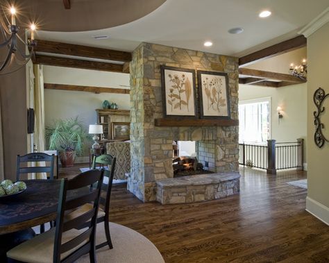 Double sided fireplace separating the kitchen and living room. This would open up the living space a bit more (since everyone ends up in the kitchen anyway) and still keep your fireplace. Craftsman Dining Room, Two Sided Fireplace, Brick Fireplace Makeover, Double Sided Fireplace, Home Fireplace, Living Room With Fireplace, Fireplace Design, Stone Fireplace, Custom Home Builders