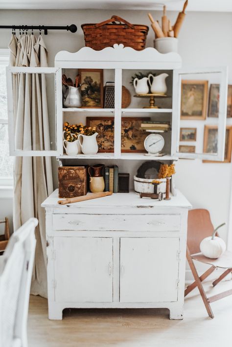 Vintage white hutch styled with fall tones and vintage items.  White pumpkins, old books, rolling pins, ironstone pitchers and antique pictures. Kitchen Hutch Decorating Ideas, How To Style A Hutch, Kitchen Hutch Decor, Living Room Hutch, White Hutch, Hutch Styling, Vintage Hutch, Fall Tones, Kitchen Hutch