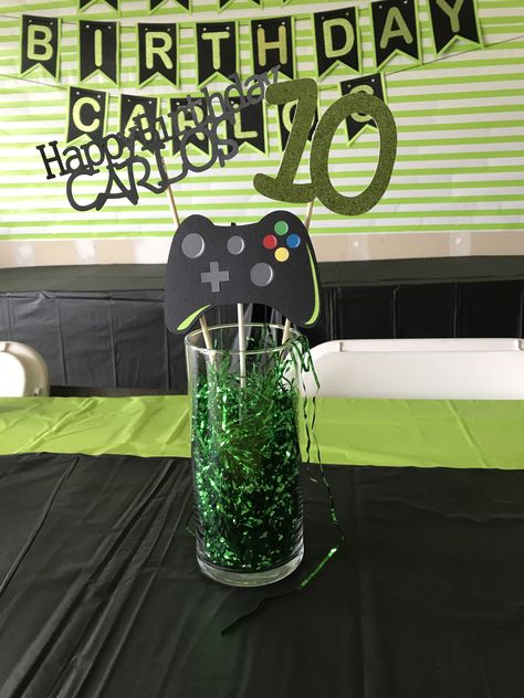 Birthday centerpiece for gamers Gamer Party Centerpiece, Video Game Centerpieces, Video Game Centerpiece Ideas, Gamer Centerpieces, Gamers Party Ideas, Xbox Birthday Party, Playstation Party, Xbox Party, Video Game Party Decorations