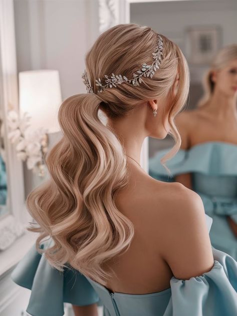 A soft, wavy ponytail styled elegantly for a bridal look. The hairstyle features a sparkling silver leaf hairpiece that enhances the sophisticated charm, perfect for weddings or formal occasions. Loose Ponytail Hairstyles Wedding, Bridal Hair Ponytail With Veil, Elegant Ponytail Hairstyles Wedding, Pony Tailed Hairstyle Wedding, Wavy Ponytail Hairstyles, Bridal Ponytail Hairstyles, Fancy Ponytail, Bridal Ponytail, Wedding Ponytail