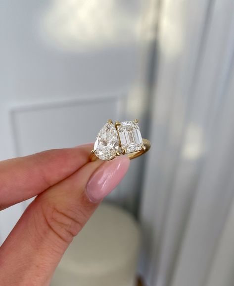 Double diamonds✨️  One thing to keep in mind when shopping for a Toi et Moi engagement ring is to use the stone dimensions rather than the carat weight!💍⁠ ⁠ Stone shapes can carry carat weight differently, with some having a larger face and some slightly smaller.⁠ ⁠ So, if you want your toi et moi stones to be as close as possible in size, use the length x width dimensions💎⁠ ⁠  Ring Details:⁠ Amor - Pear and Emerald Toi Et Moi Pear: 2.35cts / Emerald: 2.53cts   #toietmoi #engagementrings Pear And Square Diamond Ring, Gold Two Stone Engagement Ring, Emerald And Pear Toi Et Moi, Toi Et Moi Ring Emerald Cut, Emerald Cut And Pear Engagement Ring, Et Moi Engagement Ring, Toi Et Moi Marquise And Emerald, Moi And Toi, Double Jewel Engagement Ring