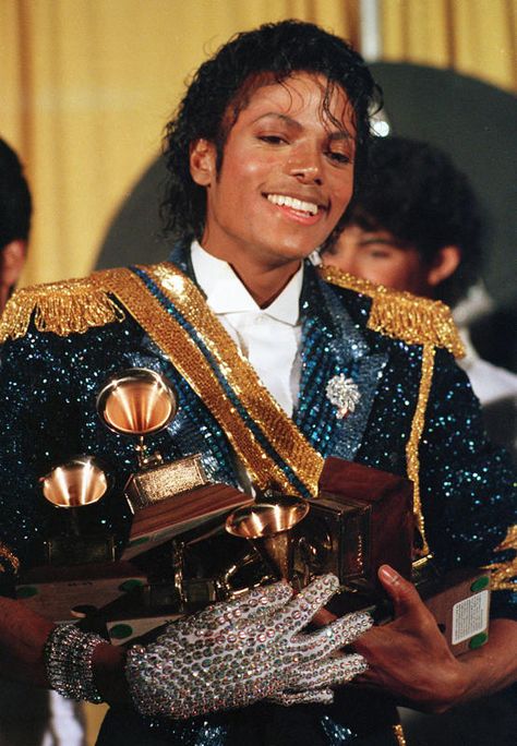 Michael Jackson was the first artist to win eight Grammys in a single night (a record since tied by Carlos Santana) when he swept with his "Thriller" album in 1984. Thriller Album, Michael Jackson Costume, Jheri Curl, Old Posters, Michael Jackson Images, Michael Jackson Wallpaper, Photos Of Michael Jackson, Michael Jackson Thriller, Michael Jackson Smile