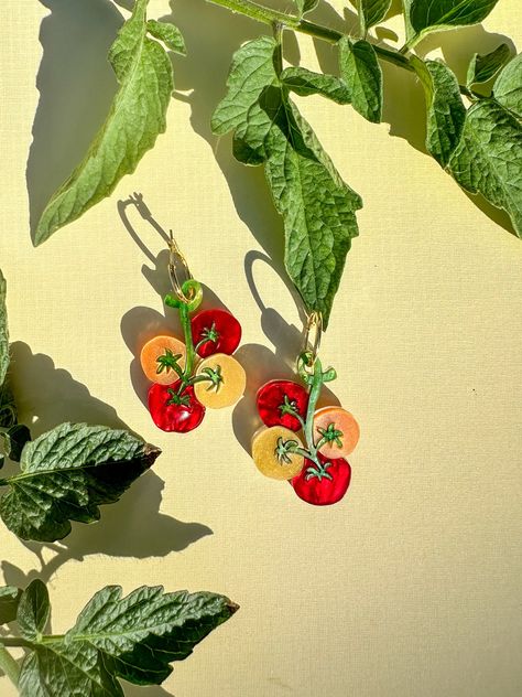 ! Clip-on and Hook are available. Please leave me a note at checkout!  The earring features a vibrant and detailed cherry tomato design that looks good enough to eat! Perfect for casual wear, garden parties, foodie events, and more. Add a playful touch to any outfit!  Length: ~2 inches (including hoop length) Each design of earrings is unique and cannot be exactly replicated. Extremely light and comfortable to wear. Slight variation may occur compared to the pictures as they are handmade items. Tomato Design, Shrinky Dink Earrings, Novelty Earrings, Acrylic Earring, Mini Earrings, Earrings Summer, Fruit Earrings, Funky Earrings, Cherry Tomato