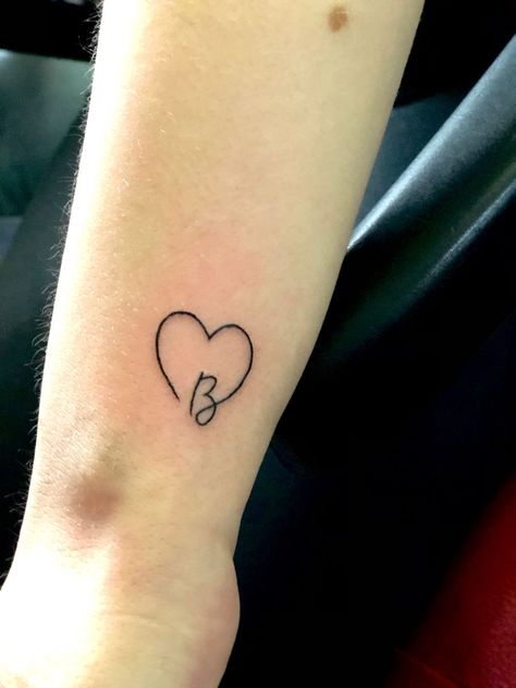 Smal tattoo on the wristLetter B heart Heart With B Tattoo, Cursive D Tattoo With Heart, Cute Initial Tattoos Heart, Heart With D Tattoo, Initial B Tattoo Ideas, H Heart Tattoo, Initials With Heart Tattoo, Heart Tattoo With Initials Letters, B With A Heart Tattoo