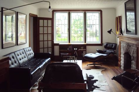 Dark, Wood-filled 1938 Toronto Bungalow House Call | Apartment Therapy Masculine Decor Apartment, Dark Wood Paneling, Masculine Apartment, Leaded Windows, Industrial Living Room Design, Bungalow Interiors, Masculine Decor, Shag Carpet, Dark Furniture