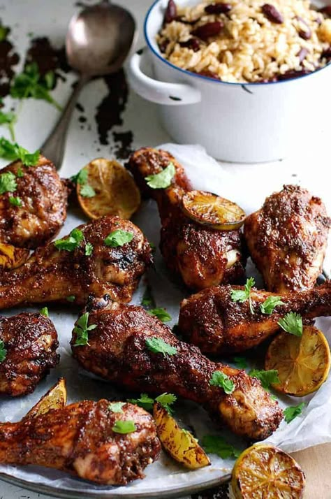 Jamaican Jerk Chicken Drumsticks and Caribbean Rice with Red Beans - the strong, spicy flavours of this chicken is the best from the Caribbean! Easy to make with everyday ingredients. Jamaican Food Photography, Caribbean Beans, Jerk Rice, Jerk Chicken Drumsticks, Rice With Red Beans, Jerk Chicken With Rice, Baked Jerk Chicken, Caribbean Rice, Rice With Beans