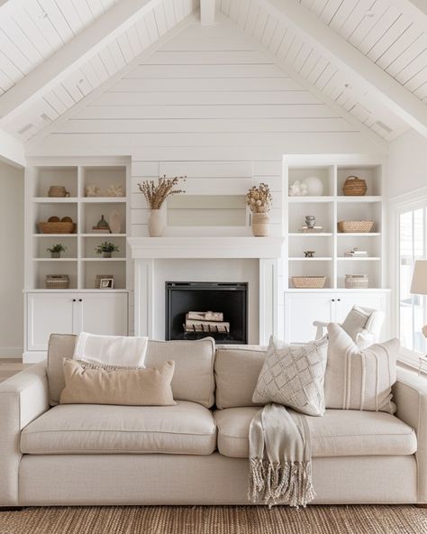 This living room totally captures the modern farmhouse vibe I love! With its vaulted ceilings and shiplap walls, it feels open and airy, but still super cozy. The built-in shelves around the fireplace? Such a great way to add a personal touch with your favorite decor, while keeping everything organized. I’m all about the mix of soft neutrals and textured accents that give the space warmth without feeling cluttered. Plus, with those big windows letting in all that natural light, it’s the perfe... Built Ins Around Fireplace Cathedral Ceiling, Vaulted Ceiling Living Room Fireplace Built Ins, Built In Cabinets Around Fireplace Vaulted Ceiling, Built In Shelves Living Room Vaulted Ceiling, 3 Sided Fireplace With Shiplap, Tall Fireplace Wall High Ceilings Shiplap, Valted Ceiling Fireplace, Vaulted Fireplace Wall, Family Room Couch