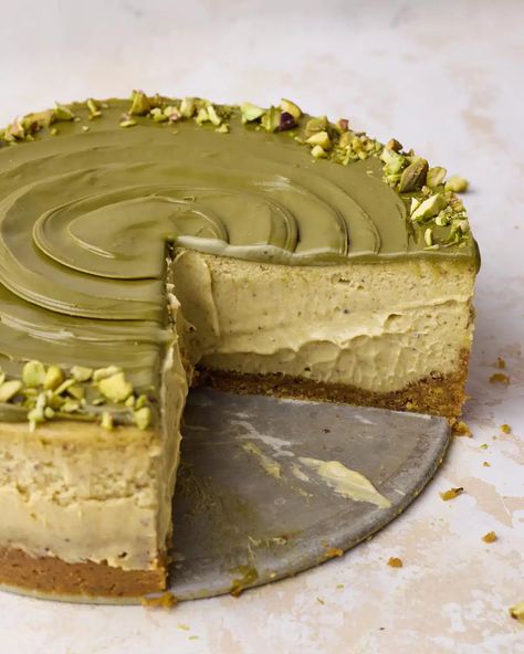 This easy pistachio cheesecake is a baked cheesecake with pistachio graham cracker crust, pistachio cheesecake filling and topped with pistachio cream and chopped pistachios. With pistachio paste in the cheesecake batter and pistachio cream on top, this delicious dessert is packed with pistachio flavor. Delicious dessert for dinner parties or holidays. Easy Pistachio Cheesecake Recipe, Honey Pistachio Cheesecake, Pistachio Gift Ideas, Best Pistachio Dessert, Cheesecake Recipes Pistachio, Pistachio Ricotta Cheesecake, Pistachio Cream Cheesecake, Pistachio Butter Recipe Ideas, Pistachio Basque Cheesecake