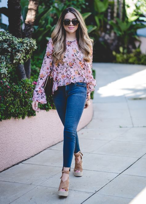 Here are a few snapshots of a look I wore over the weekend during our trip to Los Angeles. Thankfully, we lucked out with some beautiful weather and 70° temperatures. It was a nice break from the rain back in Dallas! This floral ruffled top was the perfect blouse to wear as we explored the city. It’s light and … Floral Top With Jeans, Floral Tops Outfit, Beautiful Tops With Jeans, Floral Shirt Outfit Women, Jeans And Blouse Outfit, Zimmerman Top, Floral Blouse Outfit, Floral Top Outfit, Blouse With Ruffles