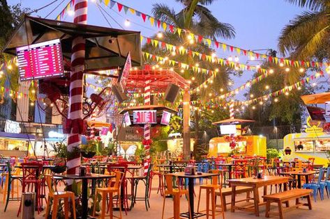 Drinks, Snacks & More – Mumbai Just Got A New Food Truck Park - Homegrown Open Air Cafe, High Table And Chairs, Cozy Cafe Interior, Beer Garden Ideas, Food Truck Park, Open Air Restaurant, Truck Theme, Bar Stock, New Food