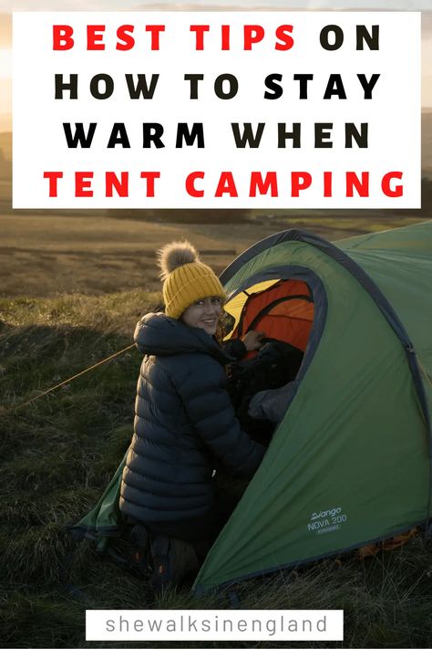 How to stay warm when camping in a tent, written by she walks in England. There is a photo of a field witting in the entrance of a tent, wearing a puffer jacket and yellow bobble hat. Camping In A Tent, Cold Camping, How To Stay Warm, Night Adventures, Countryside Village, Camping Uk, England Countryside, Cold Weather Camping, Winter Camping