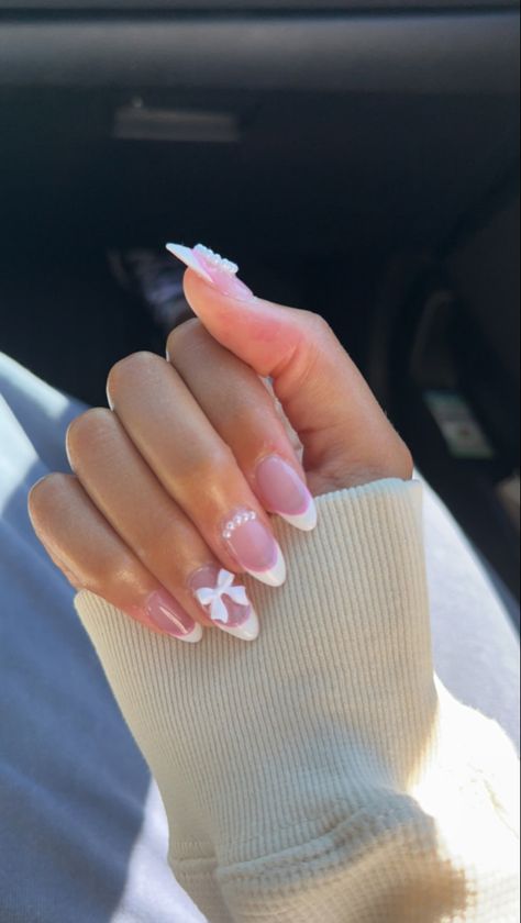 French Tips Coquette, Pink Almond Nails With Charms, French Tip Nails With Bow Charm, Pink Coquette Nails Almond, Bow Gem Nails, Coffin Bow Nails, Pink French Tip With Bow, Cute Nails With Bows, Nails Ideas Coquette