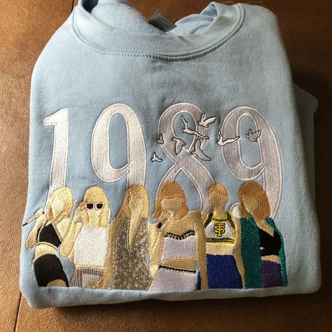 New Without Tags, Never Worn Taylor Swift Pullover 1989 Xl Fan Made Embroidered Blue Sweatshirt Pullover 1989 Era Size Extra Large Measurements Shown In Photos Taylor Swift Sweatshirt, Taylor Swift Blue, Taylor Swift Top, New Taylor Swift, Taylor Swift Tops, Taylor Swift Tour Outfits, Swift Tour, Tour Outfits, Embroidered Sweatshirt