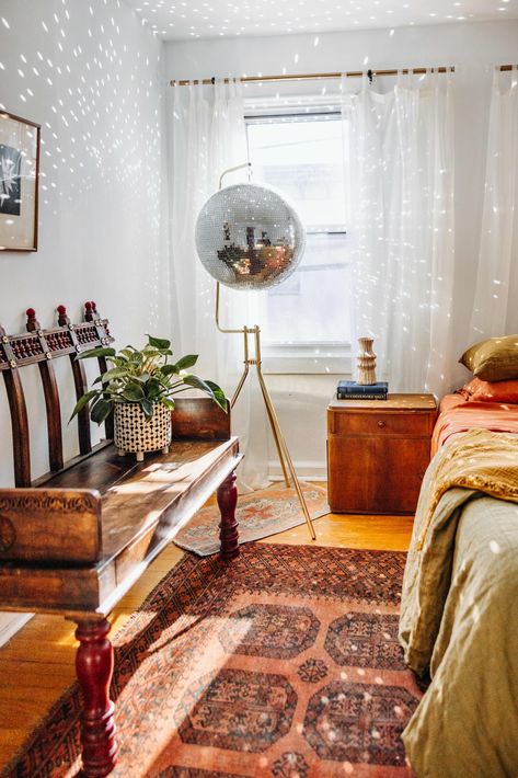 See Inside This Artist and Designer’s Philly Rowhome | Apartment Therapy Philly Rowhome, Vintage Disco Ball, Rust Accents, Apartment Lounge, Disco Ball Light, Vintage Disco, Globe Decor, Night Table, Gallery Walls