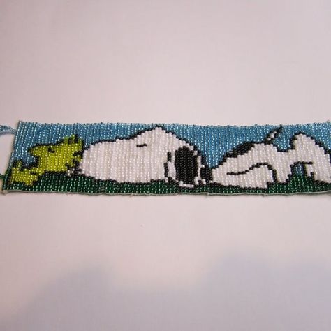 Celebrate the timeless friendship of Snoopy and Woodstock with this charming Peanuts Bracelet. Handmade with care, this bracelet is woven together on a loom using glass seed beads and thread, taking anywhere from 5 to 7 hours to complete. Its seed bead toggle clasp ensures a secure fit, while the 8-inch length makes it perfect for any wrist size. Show off your love for Peanuts and add a touch of playful style to any outfit. Beaded Toggle Clasp, Spartanburg Sc, Playful Style, Seed Bead Bracelet, Book Marks, 7 Hours, Glass Bracelet, Snoopy And Woodstock, Bead Bracelets