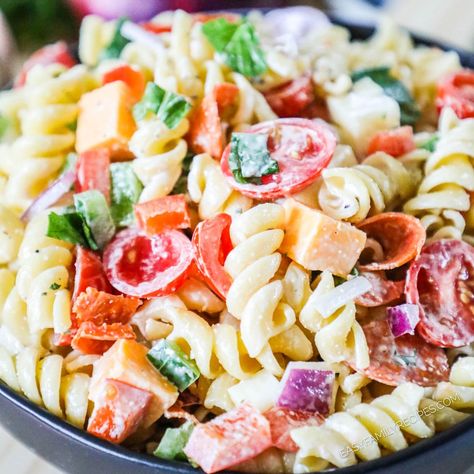 This Rotini Pasta Salad is a simple and incredibly tasty entree, side dish, or appetizer! This cold pasta salad with Italian dressing is made with tender rotini noodles tossed with pepperoni, fresh bell pepper, and cheese cubes in a creamy Italian dressing. It's an easy, healthy, 30 minute easy pasta salad recipe you'll be making again and again! Creamy Rotini Pasta Recipes, Homemade Creamy Italian Dressing, Rotini Pasta Recipes, Pasta Salad With Italian Dressing, Creamy Italian Dressing, Rotini Pasta Salad, Lemon Vinaigrette Dressing, Vinaigrette Dressing Recipe, Baked Pesto Chicken