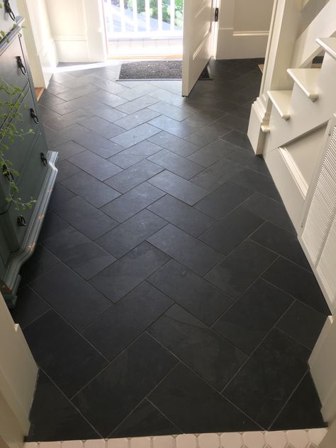 Black Hexagon Tile Mudroom, Mudroom Entryway Flooring, Gray Hexagon Tile Floor Mudroom, Herringbone Tile Entry, Dark Tiled Kitchen Floors, Black Floor Tile Laundry Room, Black Herringbone Tile Floor Entryway, Laundry Room With Black Tile Floor, Charcoal Floor Kitchen