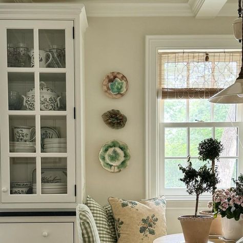 Heather Strommen on Instagram: "🏡✨ Creating a storied home in Little Oak takes time (A LOT OF TIME,) patience, and a whole lot of trusting your gut.   This little breakfast corner is starting to tell a sweet story, and for today—that’s all I need. Embracing the journey of curating my space and letting my instincts guide me.   📣We are now offering consultations! Check out the design page on our website. We’d love to share our ideas about your space.   Fun facts: *We were putting up our new Chik blinds from @virginiatupker and we had to move all the ladies over-long story short-they looked so sweet on the breakfast table.  *Table @modernhistoryfurniture  *Light @devolkitchens  *Fabric @claremontus @ian_mankin @bennisonny  *Cabinets are PAINTED @benjaminmoore Marscarpone. Ceiling/walls are Ian Mankin Fabric, Chik Blind, Heather Strommen, Breakfast Corner, Ian Mankin, Wall Arrangements, Paint Guide, Breakfast Rooms, Kitchen Banquette