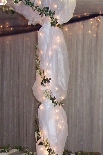 Gossamer and tulle are a way to decorate the wedding and reception venues with inexpensive elegance. Wedding Arch Tulle, Tulle Wedding Decorations, Pillar Decor, Tulle Decorations, Fun Wedding Decor, Wedding Ceremony Ideas, Lights Wedding Decor, Church Wedding Decorations, Arch Decoration