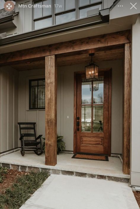 Adding Wood Accents To Exterior House, Tan Black Exterior House, Dark Gray House Cedar Accents, Exterior Wood Trim On House, Black Farmhouse With Wood Accents Exterior, Nature Exterior House Colors, Color Ideas For House Exterior, Tan House With Wood Accents, Wood Eves Exterior