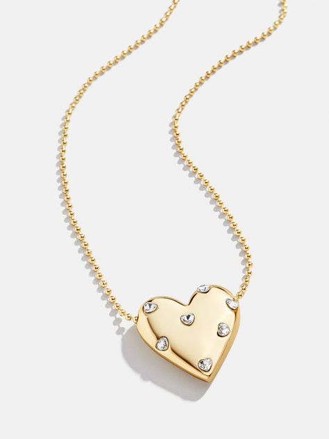 Shop all necklaces at BaubleBar, featuring everyday gold chain necklaces, personalized pendants & statement charm necklaces. Enjoy free UPS shipping over $75 & free returns. Minimal Gold Jewelry, Gold Chain Necklaces, Lizzie Hearts, Gold Heart Pendant, Heart Shaped Jewelry, Heart Pendant Gold, Gold Jewelry Necklace, Gold Necklace Designs, Layered Jewelry