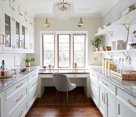 You might be able to further justify adding a butler's pantry to your home if you're able to get even more mileage out of this space. One great way to do just that is to incorporate desk space for working in peace. Zaveloff designed this walk-in pantry with a desk placed underneath a sunny window. #organization #cleaning #marthastewart Walk In Pantry With Desk, Walk In Pantry With Windows, Butler Pantry Office Combo, Butlers Pantry Office Combo, Butlers Pantry With Desk, Pantry With Desk Area, Desk In Pantry, Walk In Pantry With Window, Pantry With Desk