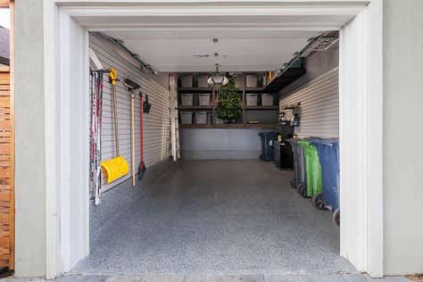 The concrete flooring and foundation were finished with a Nightfall Floortex floor coating. Gray slatwalls were installed with hooks and baskets to increase the amount of wall storage. A four foot LED light brightens up the space and the entire garage was painted to make it all look like new. Storage bins were also used to reduce the clutter and keep the space looking tidy. 1 Car Garage Organization Ideas, Single Car Garage Organization, Small Garage Design, One Car Garage, Garage Organizer, Garage Organization Tips, Garage Renovation, Garage Apartment Plans, Garage Organization Diy