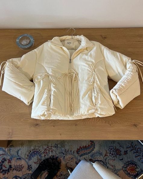 Bow Puffer Jacket - Cream ˚ ₊˚ˑ༄ؘ | Instagram Windbreaker Outfit, My Mum Made It, White Windbreaker, Yellow Coat, Straight Jacket, Baby Yellow, Puffy Jacket, Seasonal Fashion, Puffer Coat