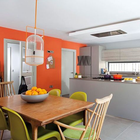 A feature wall painted orange creates a strikingly fresh look Colorful Kitchen Appliances, Orange Dining Room, Blue Grey Living Room, Grey Kitchen Colors, Orange Kitchen Decor, Gray Bathroom Decor, Tangerine Dream, Living Room Orange, Orange Kitchen