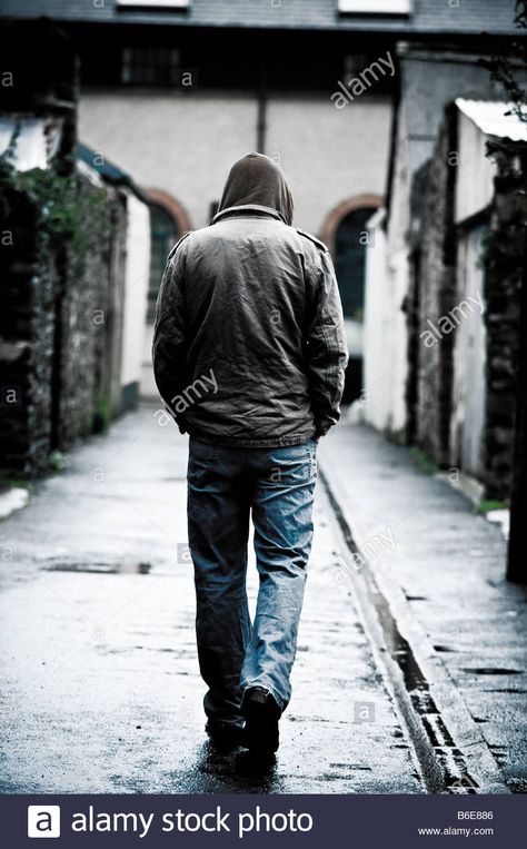 Download this stock image: Young man wearing a hooded jacket alone and isolated walking down an alleyway in a city UK seen from behind walking away - B6E886 from Alamy's library of millions of high resolution stock photos, illustrations and vectors. Walking Behind Reference, Walking From Behind Reference, Man From Behind Reference, Man Walking From Behind, Man From Behind Drawing, Man Walking Reference, Character From Behind, Person From Behind, People From Behind