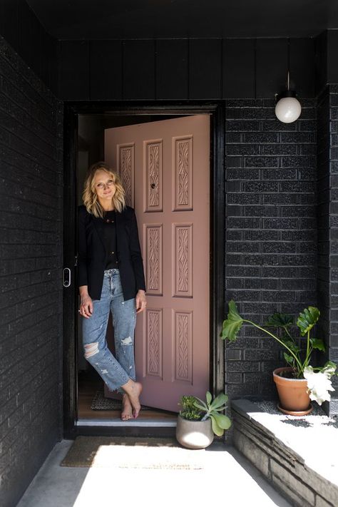 Kirsten Grove standing in front of front door and black brick wall with new Nest Hello System Black Brick House Exterior, Black Brick House, Brick Ranch Houses, Painted Brick Exteriors, Black Brick Wall, Painted Brick House, Black Houses, Brick Ranch, Brick Exterior House