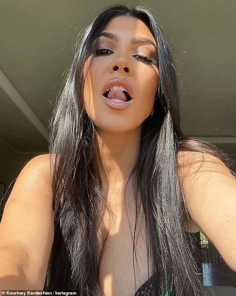 Kourtney Kardashian shows off bejeweled teeth as she flashes cleavage in black lace lingerie | Daily Mail Online Diamond Fangs, Kourtney Kardashian Barker, Rihanna Instagram, Kourtney Kardashian Instagram, Teeth Gems, Kardashian Show, Vampire Teeth, Black Lace Lingerie, Travis Barker