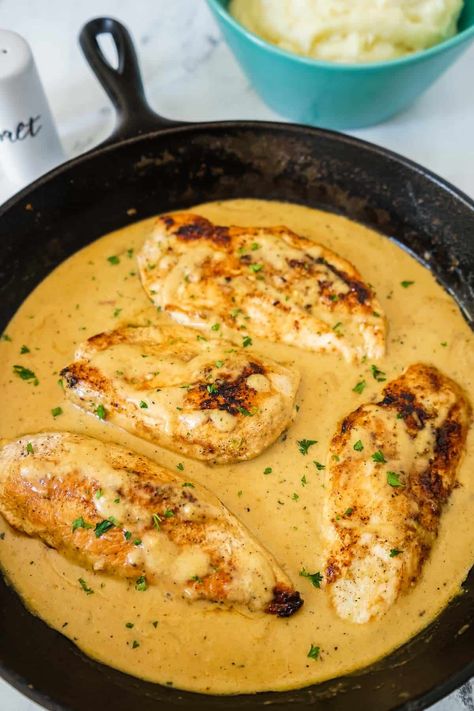 This Creamy Chicken with Mashed Potatoes has perfectly seasoned chicken breasts cooked in an amazing, rich, flavorful sauce that's made from chicken stock, cream, and a touch of Parmesan cheese! Serve it over my Perfect Mashed Potatoes and everyone will be licking their plates! This is an easy chicken dinner. Quick Mashed Potatoes, Chicken With Mashed Potatoes, Chicken And Mashed Potatoes, Red Skin Mashed Potatoes, Cream Chicken Recipes, Creamy Parmesan Chicken, Easy Chicken Dinner, Chicken Mashed Potatoes, Perfect Mashed Potatoes