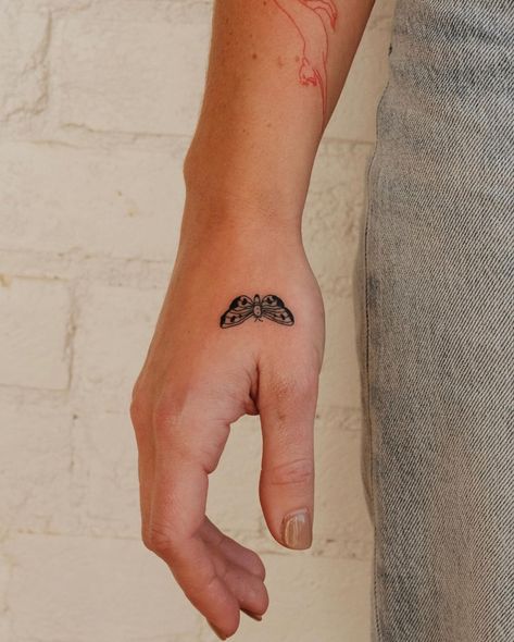 Moth Tattoo On Wrist, Small Moth Tattoo Design, Tiny Moth Tattoo Simple, Moth Small Tattoo, Mini Moth Tattoo, Moth Tattoo Minimalist, Minimalist Moth Tattoo, Moth Finger Tattoo, Moth Tattoo Hand