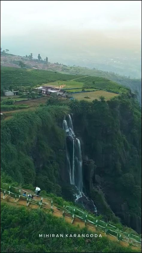 "A scenic view of a stunning mountain landscape with lush greenery and a clear blue sky above. Perfect for travel inspiration."