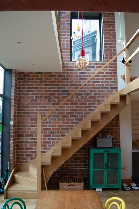 The beautiful double height space flooded with natural light from the crittall glazing in this rear two storey extension, with exposed reclaimed brick walls, to a Victorian property by Butterfield Architecture Ltd. Two Storey Extension, Reclaimed Brick Wall, Double Height Space, Basement Conversion, Timber Stair, Basement Renovation, Reclaimed Brick, Double Height, Rear Extension