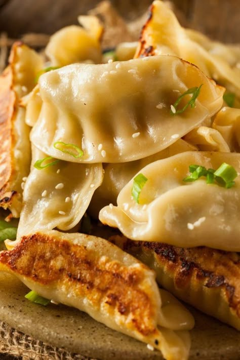 Chinese Dumplings - Potstickers - are easy to make and taste SO much better when you make them homemade! #ChineseDumplings #Potstickers #Pork #TakeOut #Dumplings #PorkDumplings #ChineseFoodRecipes #ChineseRecipes #DumplingRecipes Pork Potstickers Recipe, Momos Food, Dumplings Recipe Chinese, Koreansk Mad, Potstickers Recipe, Chinese Dumpling, Homemade Chinese Food, Homemade Chinese, Chinese Dumplings